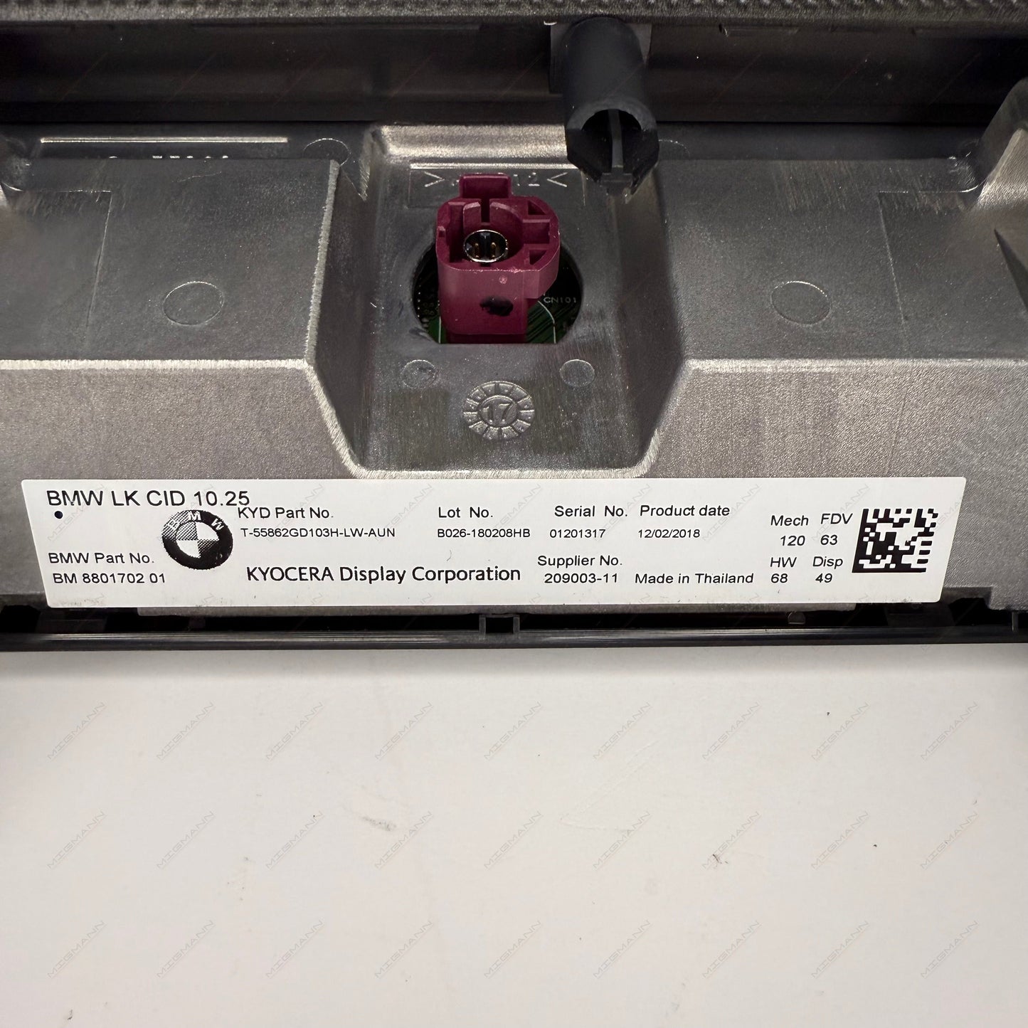 OEM part number label on BMW iDrive display 8801702