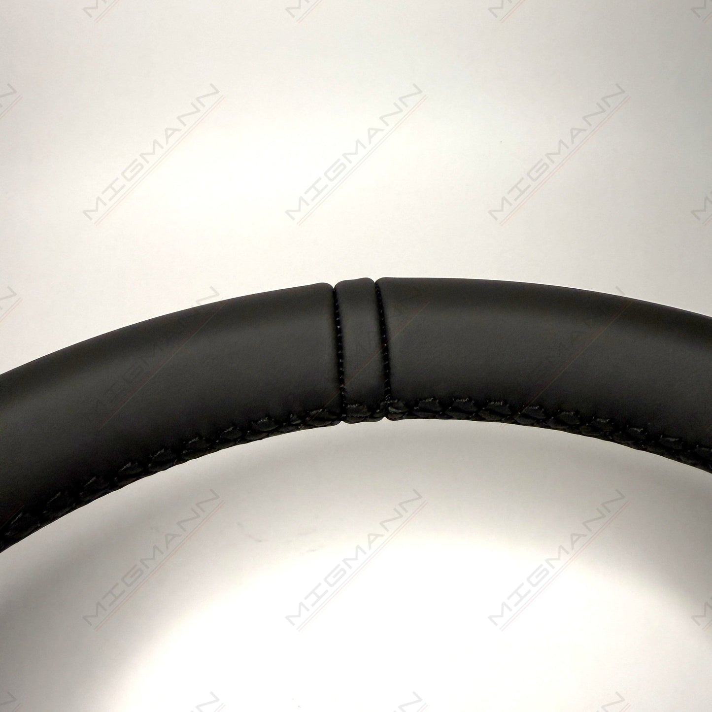 Close-up of leather top marker on Porsche 911 steering wheel