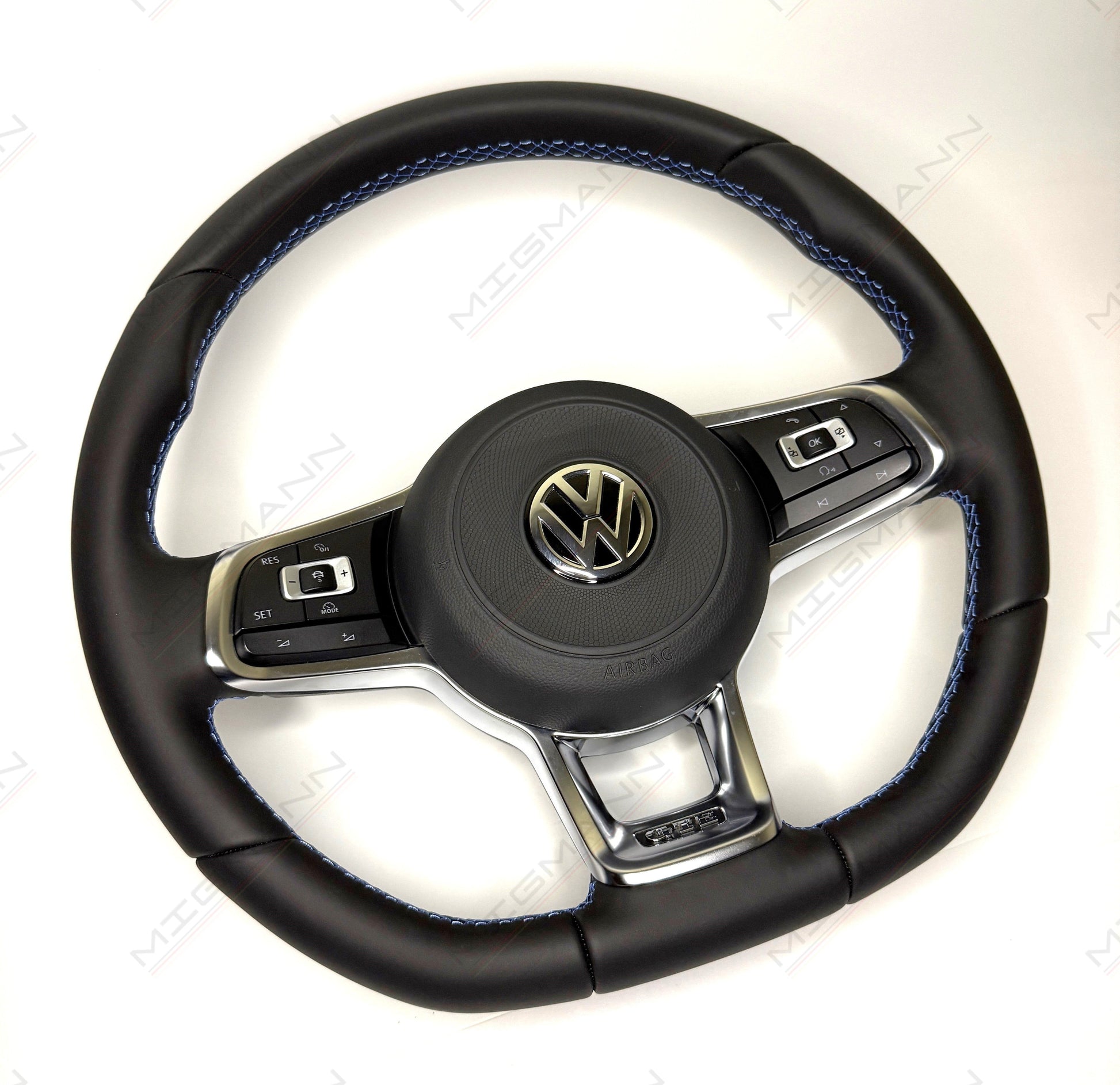 Angled view of OEM VW GTE steering wheel with airbag paddle shifters blue stitching