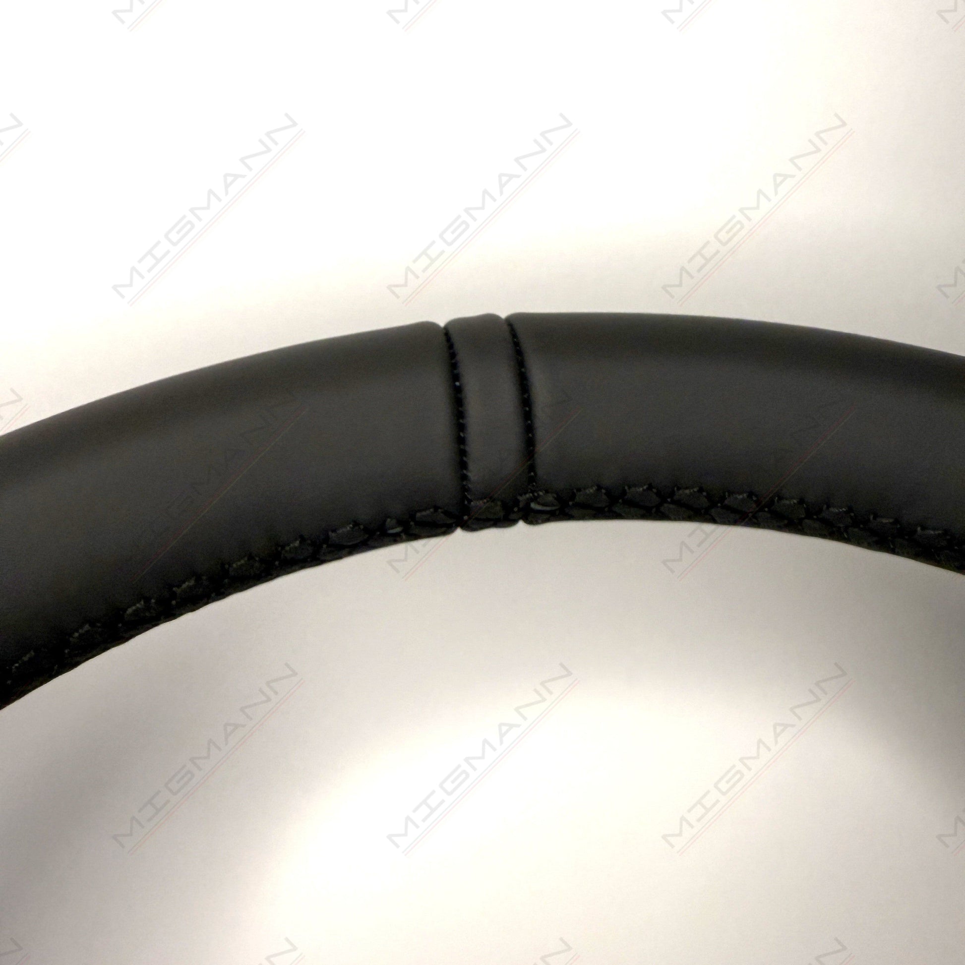 Black leather top marker detail on Porsche 911 PDK steering wheel