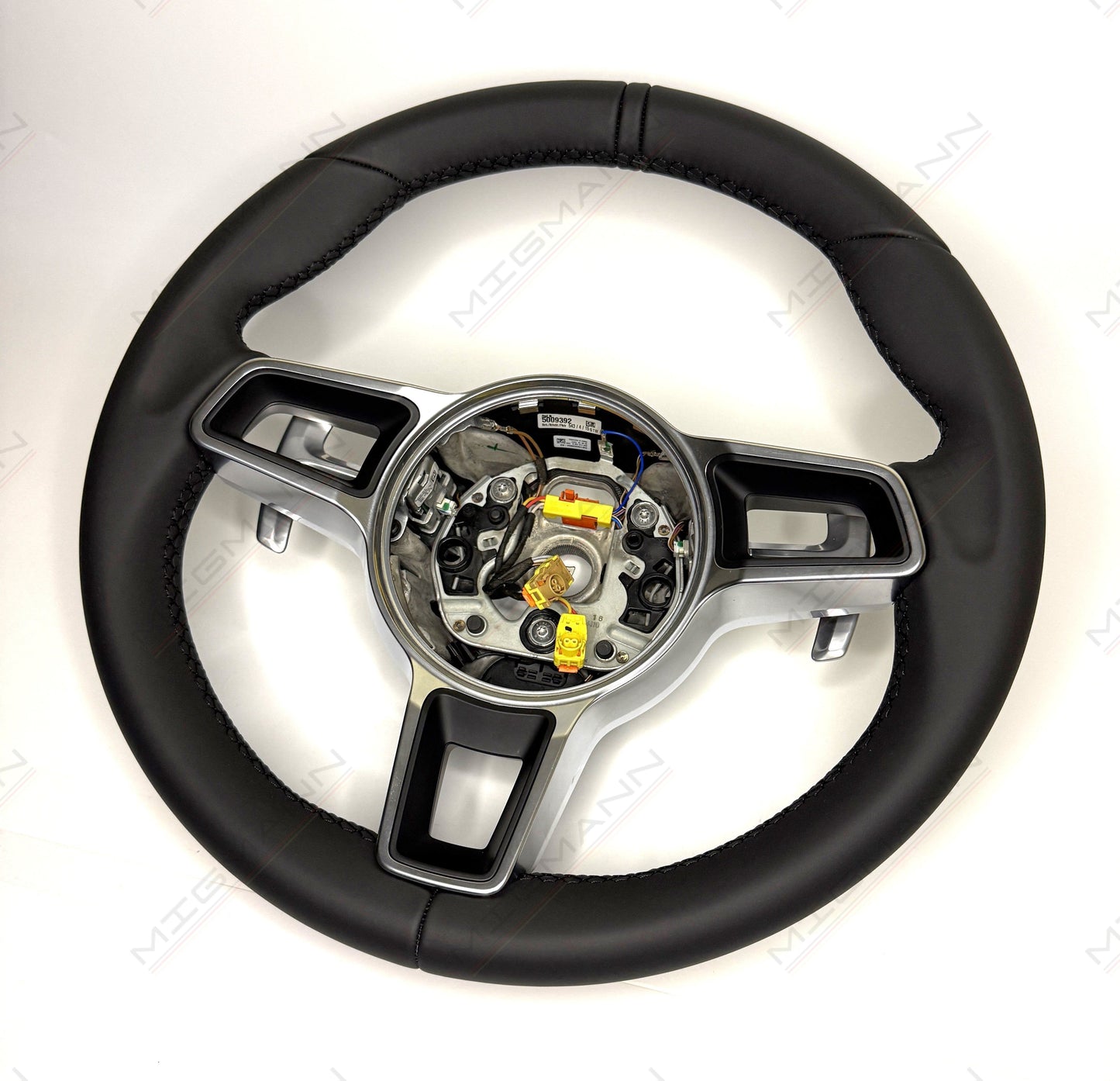 Porsche 911 black leather steering wheel with PDK paddle shifters angled view