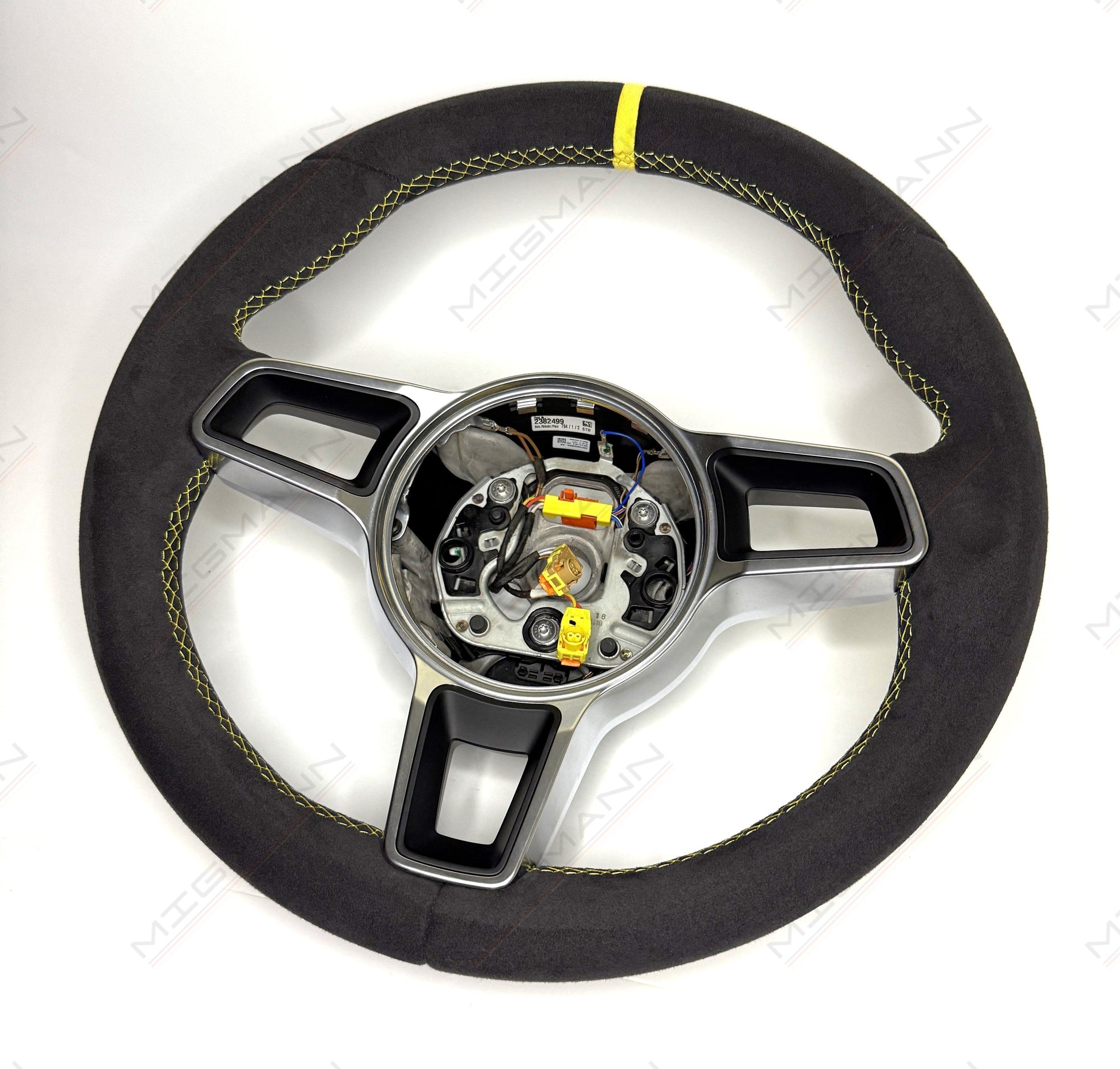 Porsche 911 grey Alcantara steering wheel with yellow stitching and no airbag angled view