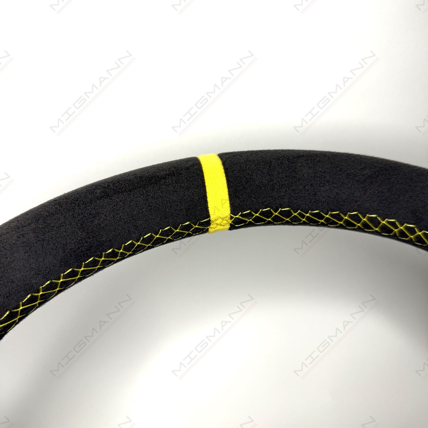 Close-up of yellow top marker on Porsche 911 Alcantara steering wheel