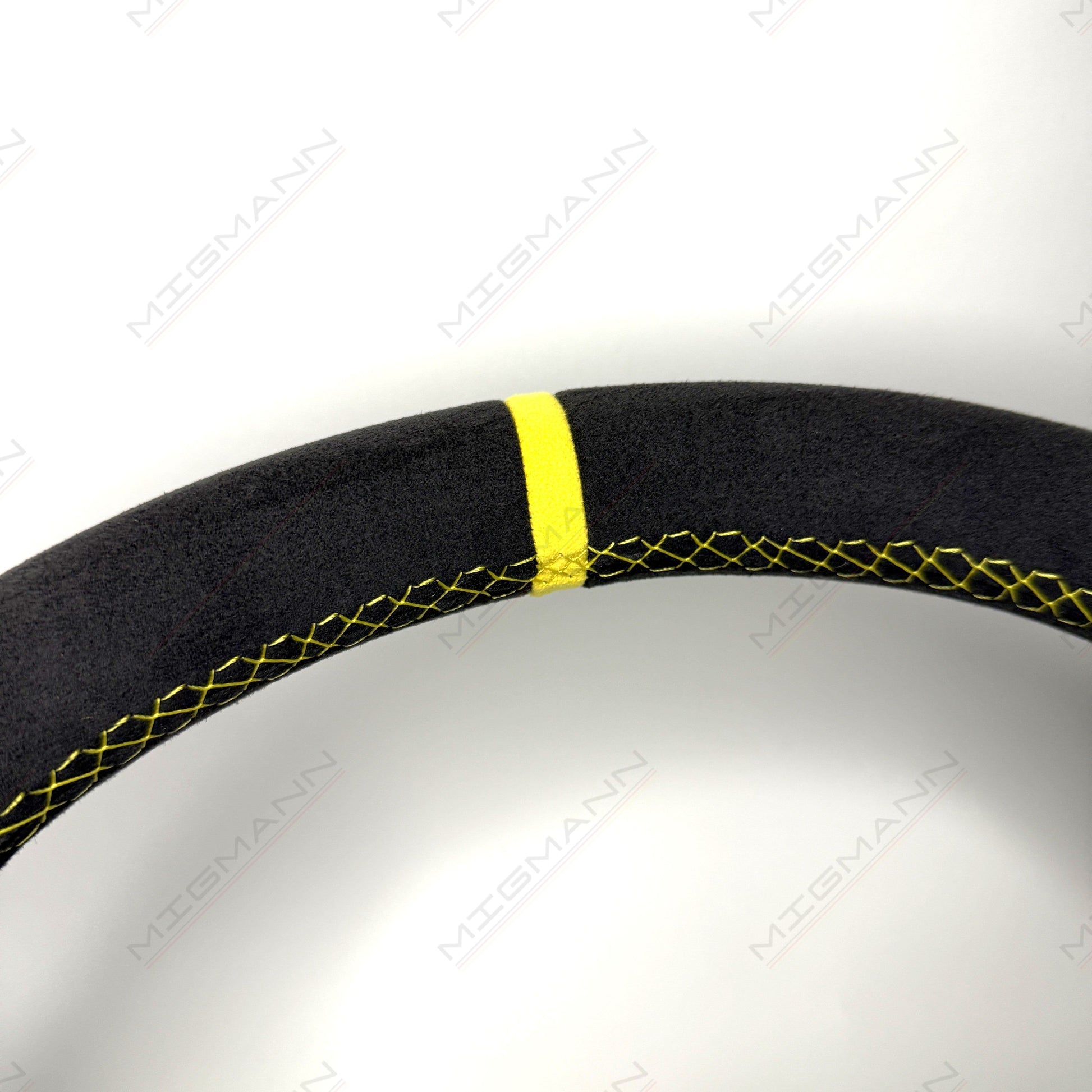 Close-up of yellow top marker on Porsche 911 Alcantara steering wheel