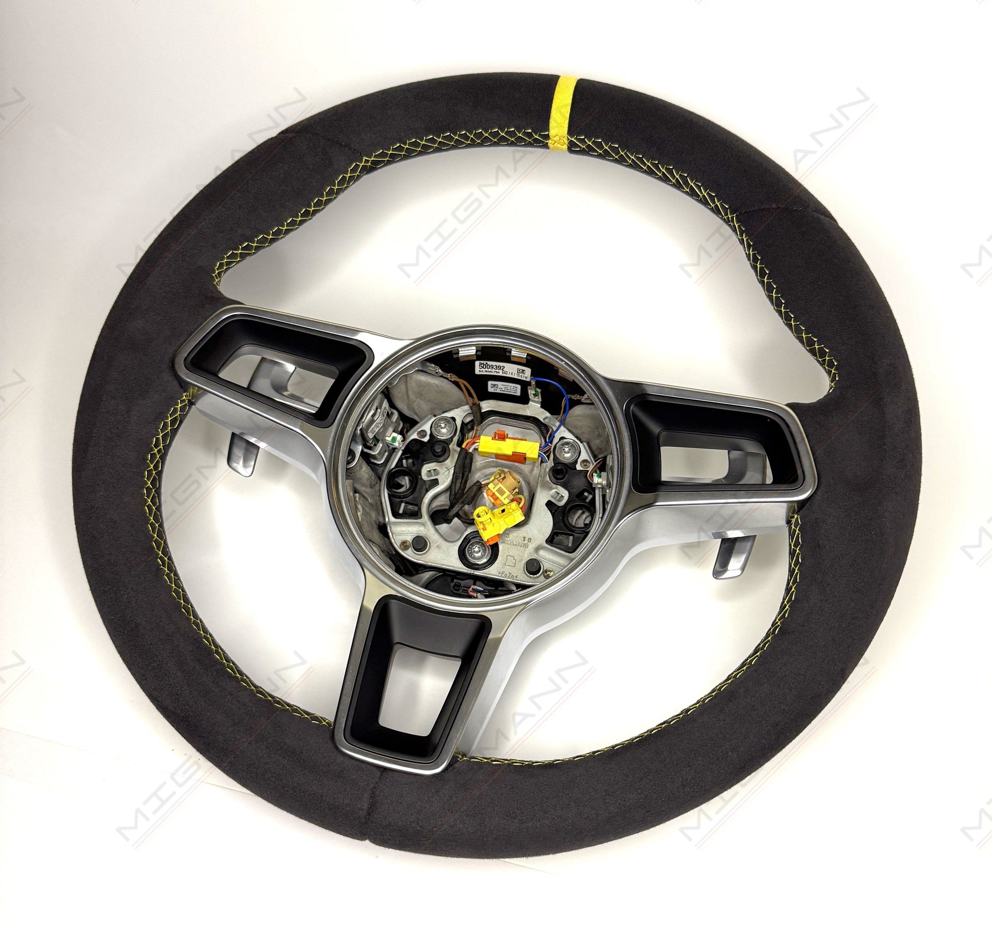 Porsche 911 grey Alcantara steering wheel with yellow stitching and paddle shifters angled view